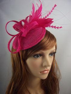 Striking handmade sinamay fascinator with feathers completes that special outfit. Whether you are a wedding guest, mother of the bride or wanting to stand out at a day at the races, this is the perfect accessory. The fascinator is mounted on a satin headband in a matching colour which makes it easy and comfortable to wear.  Measures approx 18cm or 15cm (excluding feathers). Please note fascinators are photographed displayed on a mannequin head which may be slightly smaller than an average adult head. This may result in the fascinator appearing slightly larger so please take note of the measurements before you purchase. Wedding Costume Hat With Feathers, Fitted Mini Hat With Feathers For Wedding, Wedding Mini Hat With Feather Trim For Kentucky Derby, Kentucky Derby Wedding Mini Hat With Feather Trim, Fitted Feather Fascinator For Wedding, Fitted Feather Hair Accessories For Wedding, Pink Feathered Costume Hats For Wedding, Feather Fascinator For Wedding And Royal Ascot, Feathered Fascinator For Wedding At Royal Ascot