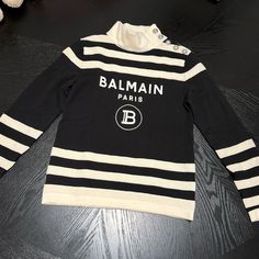 Balmain Paris Panda Sweater New Never Used New Condition White Logo Print Sweater For Fall, Luxury Logo Print Sweater For Fall, Winter White Logo Print Sweater, White Logo Print Sweater For Winter, Winter White Sweater With Logo Print, White Sweater With Logo Print For Winter, Luxury Long Sleeve Sweater With Logo Print, Luxury Logo Print Sweater For Winter, Luxury Winter Sweater With Logo Print