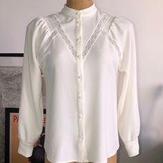 New Never Used Mint Condition Size 36 Armpit To Armpit 19” Length 24”1/2 Elegant White Button-up Blouse, Feminine White Button-up Shirt, Classic Blouse For Brunch, Classic White Tops For Brunch, Elegant Long Sleeve Shirt For Brunch, Elegant White Shirt With Lace Trim, Elegant Fitted Shirt For Brunch, White Fitted Feminine Shirt, White Feminine Blouse For Work