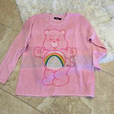 Rare Vintage Y2k Care Bears Stretch Knit Sweater From Iron Fist Size 2xl Brand New Oversized Fit Fun Pink Tops For Loungewear, Trendy Pink Sweater With Graphic Print, Pink Cartoon Print Top In Relaxed Fit, Pink Relaxed Fit Tops With Cartoon Print, Pink Cartoon Print Tops For Fall, Pink Tops With Cartoon Print For Fall, Pink Cartoon Print Top With Relaxed Fit, Pink Cartoon Print Tops With Relaxed Fit, Oversized Pink Top For Fun