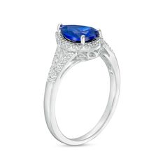 Bring royal color to any look when you wear this pear-shaped blue and white lab-created sapphire frame split shank ring in silver. Fashioned in sterling silver This choice glistens with a 9.0 x 6.0mm pear-shaped bright blue lab-created sapphire at the center. White lab-created sapphires line the halo frame and the ribbons of the split shank for added shimmer. Blue sapphire is the traditional birthstone for September and symbolizes truth, sincerity and commitment. Teardrop Sapphire Ring With Accent Stones For Formal Events, Formal Teardrop Sapphire Ring With Accent Stones, Teardrop Sapphire Ring With Accent Stones, Pear-shaped Sapphire Ring With Diamond Accents, Blue Teardrop Halo Setting Ring, Split Shank Ring, Royal Colors, White Lab, Silver Prices