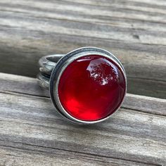 This ring will capture your heart at first sight with it's bright red glow! I have bezel set this round Rosarita stone in a handmade sterling silver setting. The band is a double wide dome which offers a super comfortable fit. The silver has been antiqued and polished for added depth a beauty.Genuine RosaritaSize 7 US this ring can not be resized925 Sterling SilverThe face of the ring is about 5/8" W and the band is about 1/4" WStamped 925 inside the bandArtisan made in Texas, USAArrives thought Metal Jewelry Making, Gemstone Rings Vintage, Jewelry Design Inspiration, Jewelry Workshop, Jewelry Studio, Trendy Necklaces, Fantasy Jewelry, Double Wide, Jewelry Inspo