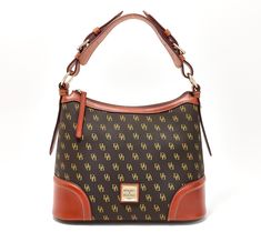 Dooney & Bourke's signature monogram makes this mid-size hobo instantly recognizable. Interior zip and slip pockets make it fully functional -- a bag-lover's dream come true. From Dooney & Bourke. Mid Size, Dooney & Bourke, Hobo Handbags, Dream Come True, Jewelry Bags, Dooney Bourke, Fashion Handbags, Make It, Monogram