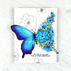 a card with blue flowers and a butterfly on it