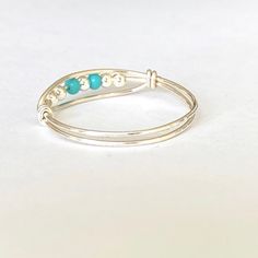 Made with sterling silver plated beads and turquoise glass beads Comfortable to wear Silver plated band is tarnish resistant Adjustable Turquoise Stackable Jewelry, Adjustable Stackable Turquoise Jewelry, Nickel-free Turquoise Toe Ring, Adjustable Turquoise Birthstone Jewelry, Adjustable Turquoise Jewelry For Promise Ring, Bohemian Silver Beaded Rings, Adjustable Silver Beads Toe Ring, Adjustable Ring With Silver Beads, Adjustable Turquoise Birthstone Ring