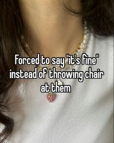 a woman with long hair wearing a necklace that says forced to say it's fine instead