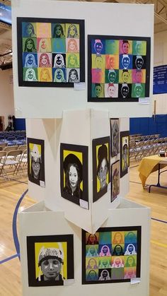 a group of pictures are stacked on top of each other in the middle of a gymnasium