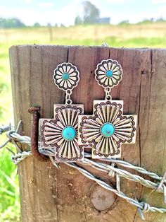 Western Metal Tooled Drop Dangle Earrings Featuring Faux Turquoise Stones Made with alloy metals Western Handmade Jewelry Stamped Earrings, Turquoise Western, Pear Earrings, Cross Shape, Cowgirl Jewelry, Western Earrings, Turquoise Accents, Turquoise Boho, Turquoise Stones