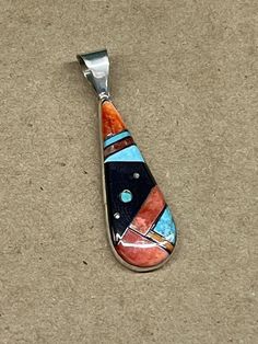 Zuni handmade sterling silver pendant 1.75" long Southwestern Turquoise Inlay Pendant Necklace, Unique Silver Turquoise Necklace With Inlay, Artisan Turquoise Pendant Necklace With Inlay, Unique Sterling Silver Turquoise Inlay Necklace, Handmade Multicolor Sterling Silver Turquoise Necklace, Gift Turquoise Necklace With Sterling Silver Inlay, Sterling Silver Multi-stone Turquoise Necklace, Zuni Jewelry, Handmade Sterling Silver