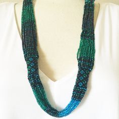 Czech Glass Bead Zulu Multi-Strand 28" Necklace Purple, Blue, Green, Bronze Bead Necklace; Shimmering Glass Beads 16 Strand Necklace With Woven Tube Accents Along 28" Length Handcrafted So Each Is A One Of A Kind Necklace /No Two Are Exactly Alike Easy To Open/Close Magnetic Clasp Handmade In Guatemala Using Artisan Crafted Czech Glass Beads. Principles Of Fair Trade Upheld. Visit Our Posh Closet For Complete Enchanted Collection: Necklaces,Bracelets,Earrings Turquoise Bar Necklace, Free People Necklace, Turquoise Bar, Stacked Necklaces, Necklace Purple, Enamel Necklaces, Boho Pendant, Vintage Hippie, Beaded Statement Necklace