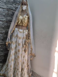 Designer custom made 3 piece  high quality lehenga for girls. Lehenga is made in georgette fabric with lining and lots of flares. Dupatta in net fabric with lace border on all four sides. Blouse is golden in silk fabric. All sizes available  Stitching  For stitched dresses you can chose from size chart or can message us for customization.our team will send you size chart for customization. Feel free to convo for any details to help you in your selection because customize dresses cannot be return or exchange.  Note: color may slightly vary because of different screen resolutions. We have an expert customization team .if you have any problem regarding taking measurements please convo for our help. All the measurements are rechecked before dispatch. Fitted Organza Pre-draped Saree With Gota Work, Fitted Organza Lehenga With Gota Work, Party Wear Gold Lehenga With Gota Work, Wedding Party Wear Pre-draped Saree With Gota Work, Gold Party Wear Sets With Gota Work, Wedding Fitted Pre-draped Saree With Gota Work, Gold Fitted Organza Pre-draped Saree, Gold Party Dress With Sheer Dupatta, White Art Silk Lehenga For Party