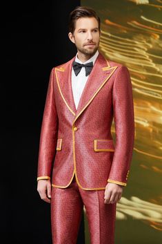 This one of a kind red tuxedo for men or women is detailed with a vibrant paisley pattern and complemented by strong golden accents. Perfect for once in a lifetime memories, this tuxedo is an absolute statement piece ready for any luxurious black tie event. FREE SHIPPING ON ORDERS OVER $199 COLOR Red COMPOSITION N/A YARN COUNT N/A WEIGHT 290g FABRIC STYLE Jacquard OCCASION Wedding/Gala Designer Fitted Suits For Gala, Red Festive Semi-formal Blazer, Luxury Festive Tuxedo For Gala, Luxury Tailored Suits For Gala, Luxury Tailored Suit For Gala Events, Tailored Luxury Tuxedo For Gala, Luxury Tuxedo With Suit Collar For Gala, Luxury Suits For Gala Party, Gold Fitted Luxury Blazer