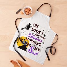 an apron with the words on it next to eggs and utensils for baking