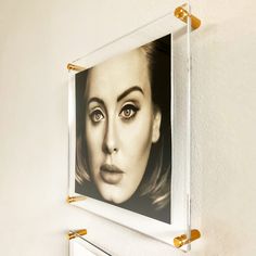 a woman's face is shown on the wall