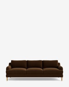 a brown couch against a white wall