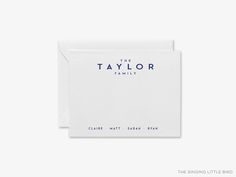 the taylor family logo on top of a white card with blue lettering and an envelope