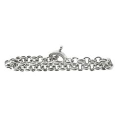 Designer: custom Material: sterling silver Dimensions: bracelet measures 9-inches in length Weight: 77.13 grams Silver Wrap Bracelet, Tiffany Bracelets, Silver Link Chain, Modern Bracelets, Circle Bracelet, Toggle Bracelet, Silver Wire, Sterling Silver Bracelets, Link Bracelets