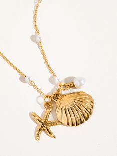 Add a touch of seaside glamour with our 18K Gold Seashell Necklace. This elegant accessory captures the beauty of the sea, perfect for beach lovers and special occasions. 18K Gold-Plated Seashell & Sea Star Pearl Necklace Non Tarnish, Stainless Steel Faux Pearl Pendant Size (inch): 0.8 x 0.8 Chain Length (inch): 16 Extension Length (inch): 2 Gold Seashell Necklace, Star Pearl, Diy Jewlery, Jewelry Accessories Ideas, Seashell Necklace, Gold Pearl Necklace, Mermaid Necklace, Sea Star, Accessories Ideas