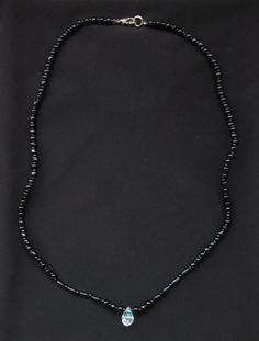 Black Bead Necklace with Crystal 18" This cute, simple necklace is made of black beads and a single teardrop shaped crystal. The silver clasp works perfectly. Measures 18". Black Oval Beaded Necklaces, Minimalist Black Teardrop Pendant Necklace, Black Beaded Necklaces With Lobster Clasp, Black Beaded Necklaces With Heart-shaped Beads, Black Beaded Necklaces With Heart And Round Beads, Black Teardrop Jewelry With Faceted Beads, Black Teardrop-shaped Jewelry With Faceted Beads, Adjustable Black Beaded Necklace With Heart Beads, Black Adjustable Teardrop Pendant Necklace