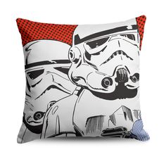 a star wars themed pillow with the image of stormtroopers and helmet on it