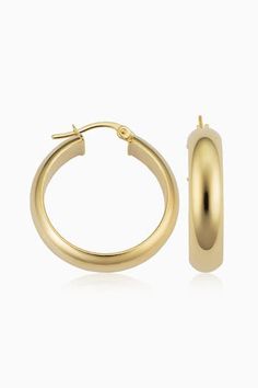 Radiant. Bold. Timeless. Our High Society Large Hoops are the statement earrings every fine jewelry collection needs. The wide, flattened solid gold tubes give them a classic, vintage feel, while the curved design creates a dome effect for maximum shine. Metal: 14 Karat Yellow Gold Dimensions: 6mm Width, 20mm Inner Diameter Construction: Solid Gold Tubing, Latch Closure Weight: 3 Grams Origin: Crafted in Arezzo, Italy Classic Gold Tarnish Resistant Hoop Earrings, Classic Gold Tarnish-resistant Hoop Earrings, Timeless Formal Hoop Earrings With Shiny Finish, Elegant Yellow Gold Hoop Earrings With Shiny Finish, Classic Earrings With Polished Finish, Classic Polished Earrings For Everyday Luxury, Classic Polished Yellow Gold Earrings, Formal 14k Gold Hoop Earrings With Polished Finish, Classic 14k Gold Hoop Earrings