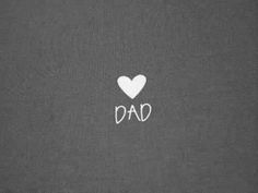 the word dad written in white on a grey background with a heart shaped sticker