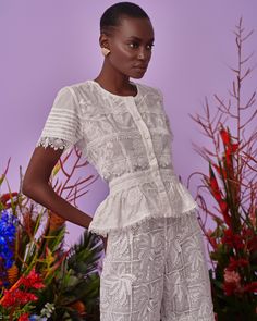 Made from airy cotton that’s intricately embroidered with blooming flowers and delicately pleated on the sleeves, our Malaga top features a soft round neck, lined buttons and fit and flare silhouette. Feminine Lace Top With Broderie Anglaise, Feminine Lace Broderie Anglaise Top, Elegant Fitted Lace Top With Broderie Anglaise, Feminine Summer Lace Top With Lace Cuffs, Feminine Floral Embroidered Tops For Garden Party, Feminine Floral Embroidery Tops For Garden Party, Lace Blouse With Broderie Anglaise Short Sleeves, Short Sleeve Lace Blouse With Broderie Anglaise, Fitted Lace Trim Top For Garden Party