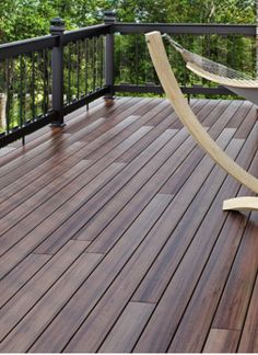 a wooden deck with a hammock on it