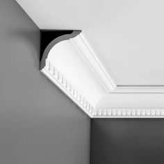 a black and white photo of a bathroom with the ceiling painted in dark gray tones