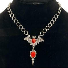 20% Off Bundles! New Without Tags. No Flaws. See Images For Details. Brand: Unknown Item: Necklace Shape: Bat Size: 15”-17” Drop: 2.75” Color: Silver Closure: Lobster Material: Silver-Tone Metal Please Ask All Questions Before Purchasing. Red Metal Jewelry With Silver Chain, Gothic Red Necklace With Chain, Red Gothic Chain Necklace, Gothic Red Chain Necklace, Red Gothic Metal Necklace, Red Metal Dangle Necklace, Gothic Red Jewelry With Lobster Clasp, Red Gothic Jewelry With Lobster Clasp, Red Nickel-free Jewelry For Halloween