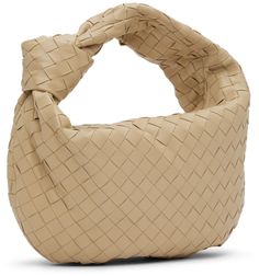 Intrecciato-woven grained lambskin shoulder bag in beige. · Integrated carry handle with knotted detailing · Zip closure · Calfskin lining · Gold-tone hardware · H12 x W15 x D4 in Supplier color: Porridge/Gold Designer Beige Shoulder Bag With Rolled Handles, Beige Leather Bags With Interwoven Design, Luxury Cream Shoulder Bag With Intrecciato Weave, Luxury Cream Intrecciato Shoulder Bag, Evening Bag With Intrecciato Weave In Beige, Beige Evening Bags With Intrecciato Weave, Beige Intrecciato Weave Evening Bag, Luxury Beige Shoulder Bag With Intrecciato Weave, Luxury Beige Intrecciato Weave Shoulder Bag