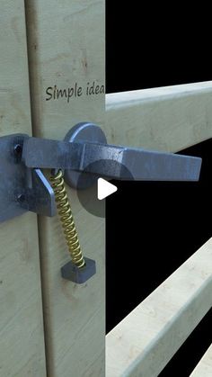 a close up of a wooden door with a metal hook on the front and side