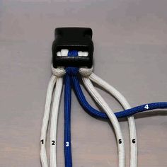 an image of a blue and white cord connected to a black box with numbers on it