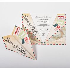 an airplane themed wedding save the date card with envelopes and stamps on it's wings