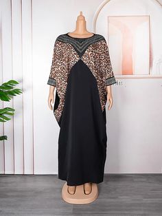 Elevate your fashion style with our luxurious Maxi Dress. Elegant Oversized V-neck Maxi Dress, Trendy Non-stretch Evening Dresses, Party Batwing Sleeve Fall Dresses, Elegant Shift Maxi Dress, Fall Party Dress With Batwing Sleeves, Summer Party Dress With Batwing Sleeves, Elegant Long Shift Maxi Dress, Casual Oversized Dresses With Batwing Sleeves, Casual Shift Maxi Dress For Party