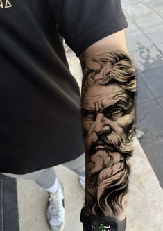 a man with a tattoo on his arm