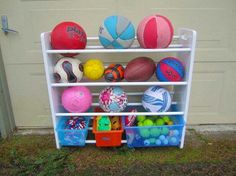 a rack filled with lots of different colored balls