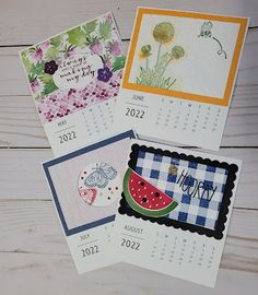 four calendars with different designs on them