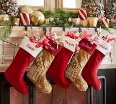 christmas stockings hanging from a fireplace mantel