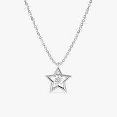 Skylar Let your inner glow shine bright with our exquisite 14k gold star necklace. This stunning necklace features a beautiful cutout star with a dangly white full-cut diamond. Choose your favorite among Yellow Gold, White Gold, and Rose Gold. - Handmade- Solid Gold- Natural Diamond - G Color, SI Quality Diamonds- Star Size: 10 mm- Total Diamond Carat Weight: 0.05 ctw All pieces come beautifully boxed in suede pouches you can always use when traveling! Diamond Star Necklace, Star Necklace Gold, Star Charm Necklace, Inner Glow, Necklace For Her, Solid Gold Necklace, Star Pendant Necklace, Bridal Bands, Diamond Star