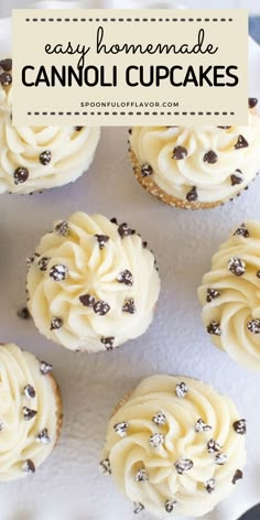 some cupcakes with white frosting and chocolate sprinkles on top