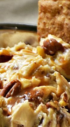 a close up of food in a bowl with crackers