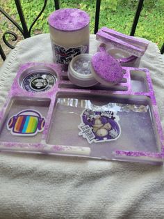 there is a tray with purple stuff on it and two cups next to each other