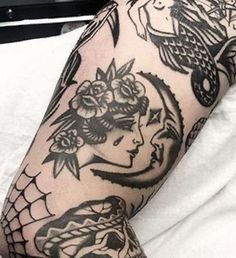 a woman's arm with tattoos on it