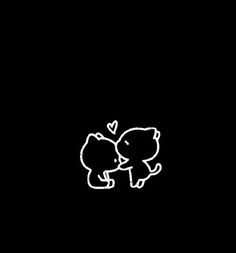 two elephants are touching each other in the dark with hearts drawn on it's backs