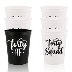 three plastic cups with the words fifty at and fifty at printed on them, all in black and white