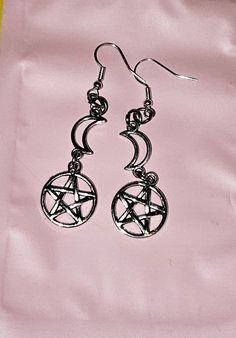 Gorgeous crescent moon and pentacle earrings 🖤 silver crescent moons with pentacles hanging on silver plated lead and nickel free earring hooks 🖤 Cute addition to any gothic/witchy earring collection 🖤 Gothic Silver Star Earrings, Silver Star Gothic Earrings, Gothic Star Shaped Metal Earrings, Gothic Star-shaped Metal Earrings, Silver Witchy Pierced Earrings, Silver Witchy Earrings, Pentacle Earrings, Witchy Earrings, Pentacles