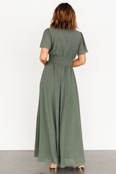 Baltic Born exclusive style Deep sage green color High-quality chiffon material that flows beautifully V-neckline Short flutter sleeves Smocked waist for a comfortable fit Pull-over style Fully lined excluding sleeves Bump friendly 100% Polyester Marianne is 5'6, cup size 34D, size 6 and wearing size S Green Chiffon Maxi Dress With Short Sleeves, Flowy Solid Color Chiffon Maxi Dress, Flowy Green Chiffon V-neck Dress, Flowy Short Sleeve Maxi Dress In Solid Color, Flowy Maxi Dress With Short Sleeves In Solid Color, Modest Green Flowy Maxi Dress, Chic Flowy Sage Dress, Flowy Short Sleeve Solid Color Maxi Dress, Flowy Green Chiffon Midi Dress