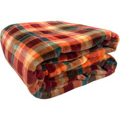 two blankets folded on top of each other in different colors and patterns, one is orange, the other is red