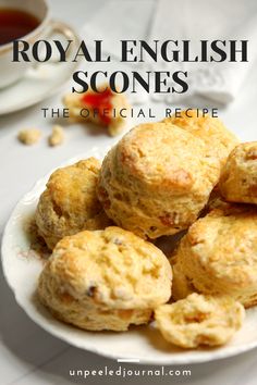 some biscuits on a white plate with the words royal english scones in front of it